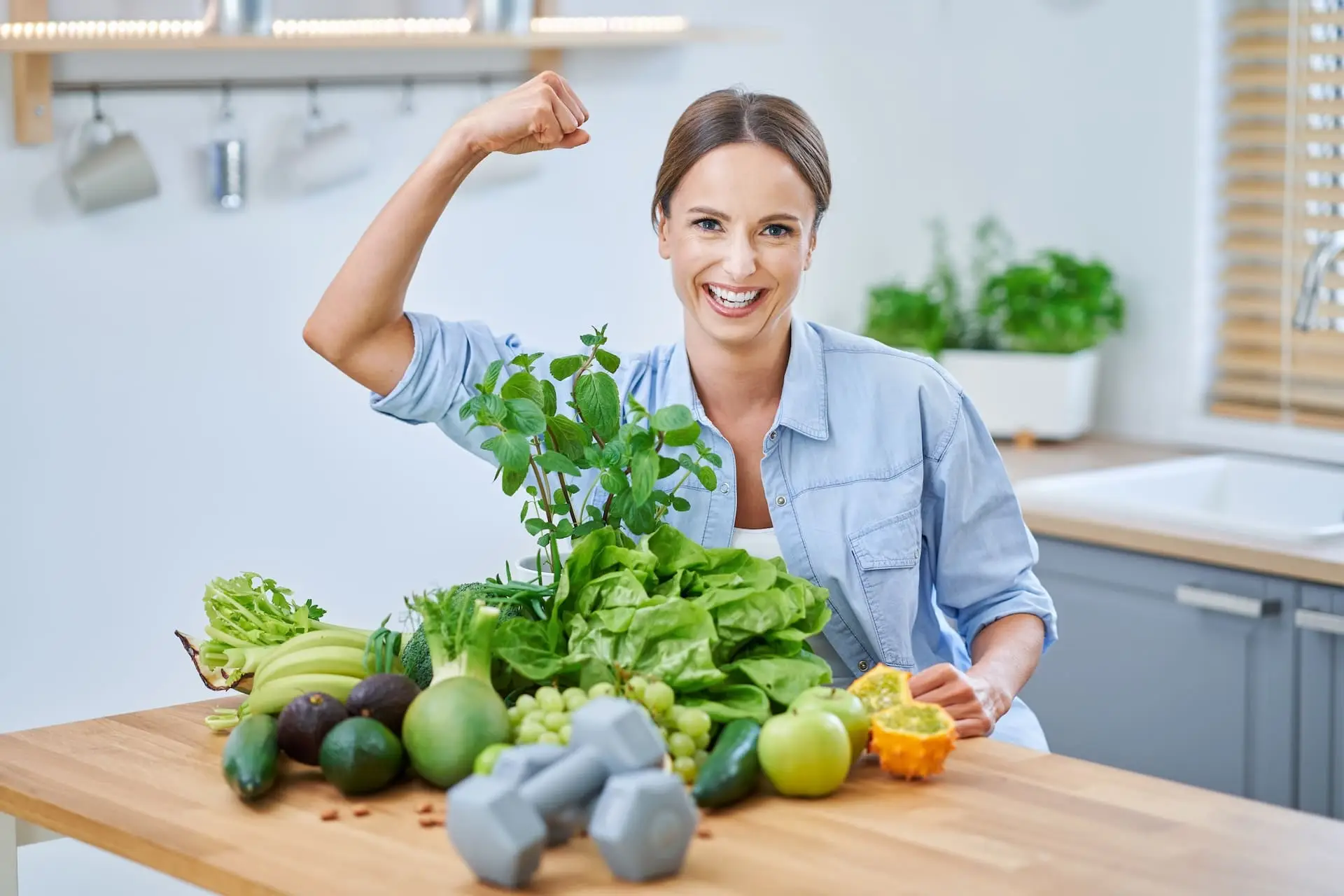 healthy-adult-woman-with-green-food-in-the-kitchen-2025-01-08-02-56-03-utc