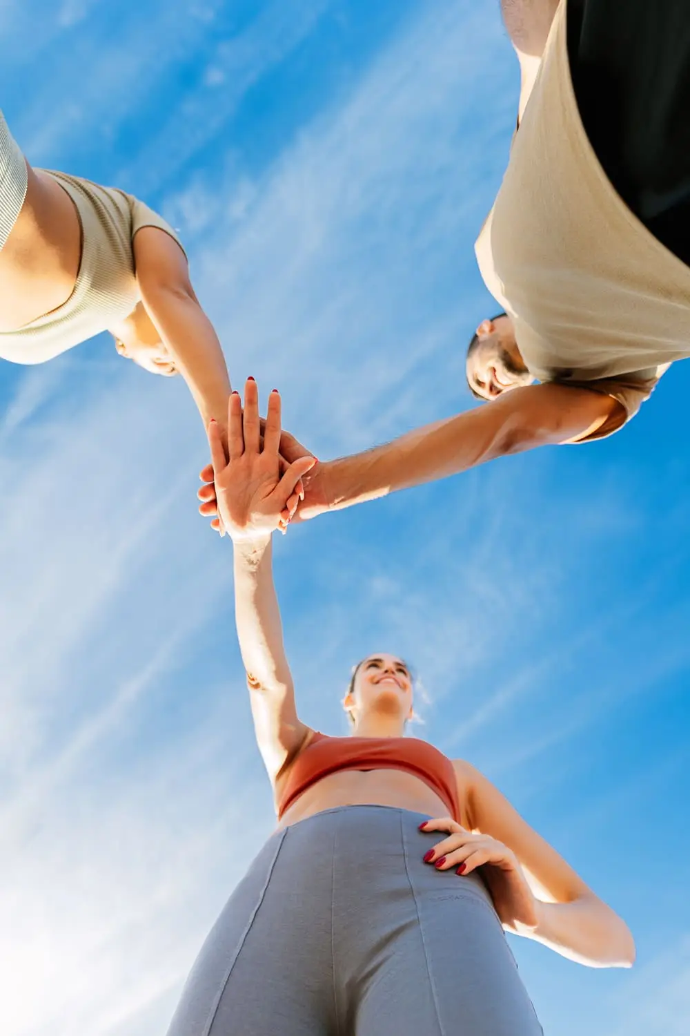 low-angle-view-of-young-group-of-sportive-friends-2024-01-09-01-33-10-utc