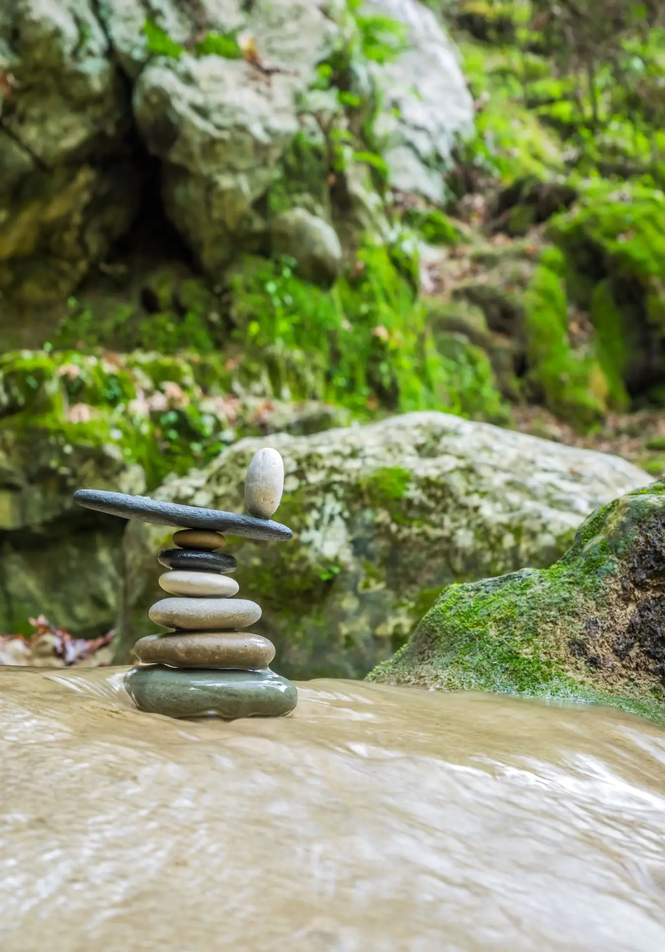 rock-zen-stack-in-front-of-waterfall-2023-11-27-05-16-55-utc
